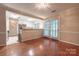 Open dining area with hardwood floors, kitchen access, and sliding glass doors to the outside at 1735 Robinwood Rd, Gastonia, NC 28054