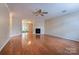 Spacious living room with hardwood floors and a corner fireplace at 1735 Robinwood Rd, Gastonia, NC 28054