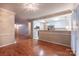 Inviting open-concept living area with hardwood floors flowing into the kitchen, with stainless steel appliances at 1735 Robinwood Rd, Gastonia, NC 28054