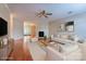 Bright living room featuring hardwood floors, a fireplace, and neutral-toned furniture at 1735 Robinwood Rd, Gastonia, NC 28054