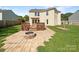 Backyard with a wooden deck, stone patio, and a built-in firepit, providing a perfect outdoor space at 1958 Leesburg Dr, Clover, SC 29710