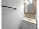 A small bathroom features neutral paint and updated vanity and faucet at 1958 Leesburg Dr, Clover, SC 29710