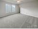 A bright bedroom features neutral carpeting and paint that makes it ideal for customization at 1958 Leesburg Dr, Clover, SC 29710