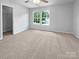 Bright bedroom with two windows, plush carpet, and a ceiling fan at 1958 Leesburg Dr, Clover, SC 29710