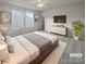 Serene main bedroom offers plenty of space, natural light, and a stylish rug, creating a relaxing retreat at 1958 Leesburg Dr, Clover, SC 29710