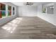 Bright living room featuring hardwood floors, ample natural light, and a modern ceiling fan at 1958 Leesburg Dr, Clover, SC 29710