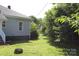 Grassy backyard offers green scenery and shade trees at 201 Park Ave, Mount Holly, NC 28120