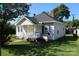 Attractive one-story home with well-maintained landscaping and a welcoming front porch at 201 Park Ave, Mount Holly, NC 28120