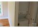 Convenient laundry area with stacked washer and dryer appliances at 201 Park Ave, Mount Holly, NC 28120
