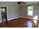 Inviting living room features gleaming hardwood floors, and a ceiling fan at 201 Park Ave, Mount Holly, NC 28120
