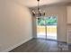 Dining room features a modern chandelier and sliding door access to the outdoor deck at 2051 Highwood Rd, Rock Hill, SC 29732