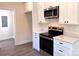 Modern kitchen featuring white cabinets and stainless steel appliances at 2051 Highwood Rd, Rock Hill, SC 29732