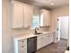 Well-lit kitchen with white cabinets, stainless steel appliances, and elegant countertop at 2051 Highwood Rd, Rock Hill, SC 29732