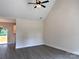 Bright living room features high ceilings, neutral walls, and sliding glass door to the outdoor deck at 2051 Highwood Rd, Rock Hill, SC 29732