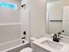 Bathroom with a shower and tub combination, white vanity with a white sink, and modern black fixtures at 2063 Highwood Rd, Rock Hill, SC 29732