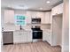 Modern kitchen with stainless steel appliances, white cabinets, and quartz countertops at 2063 Highwood Rd, Rock Hill, SC 29732