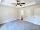 Spacious main bedroom with a ceiling fan, tray ceiling and an en-suite bathroom at 2063 Highwood Rd, Rock Hill, SC 29732