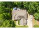 Overhead aerial view of a house with a backyard deck, boat, and verdant trees at 2074 Brandt Rd, York, SC 29745
