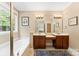 Bright bathroom with double vanity, soaking tub, and tile flooring at 2074 Brandt Rd, York, SC 29745