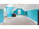 Bonus room has bright blue walls, a cozy couch, and carpeted floors at 2074 Brandt Rd, York, SC 29745