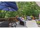 Spacious deck features seating, a table, and views of a private, wooded backyard at 2074 Brandt Rd, York, SC 29745