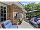 Outdoor deck featuring a seating area with comfortable blue cushions and an umbrella, perfect for relaxing at 2074 Brandt Rd, York, SC 29745