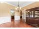 Well-lit dining area with hardwood floors, traditional chandelier and wainscoting at 2074 Brandt Rd, York, SC 29745