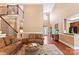 Cozy living room with hardwood floors, staircase, and a view of the foyer at 2074 Brandt Rd, York, SC 29745