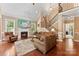 Inviting living room with fireplace, hardwood floors, and staircase at 2074 Brandt Rd, York, SC 29745