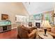 Comfortable living room showcasing a fireplace and an open layout to dining area at 2074 Brandt Rd, York, SC 29745