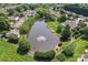 Aerial view of the neighborhood pond with a fountain and walking trails at 210 Oak Village Pkwy, Mooresville, NC 28117