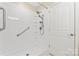 Accessible walk-in shower with multiple shower heads and safety bars at 210 Oak Village Pkwy, Mooresville, NC 28117