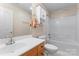 Bathroom featuring a shower-tub combo, vanity with storage, and neutral decor at 210 Oak Village Pkwy, Mooresville, NC 28117