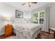 Inviting bedroom featuring hardwood floors, a large window, and neutral decor at 210 Oak Village Pkwy, Mooresville, NC 28117