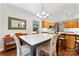 Dining room open to kitchen featuring a dark table and natural lighting at 210 Oak Village Pkwy, Mooresville, NC 28117