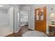 Open foyer with hardwood floors, and clear views into the Primary bedroom and a bathroom at 210 Oak Village Pkwy, Mooresville, NC 28117
