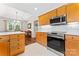 Kitchen featuring stainless steel appliances and wood cabinets at 210 Oak Village Pkwy, Mooresville, NC 28117