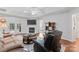 Comfortable living room with a fireplace, TV, french doors, stylish rug, and modern furnishings at 210 Oak Village Pkwy, Mooresville, NC 28117