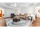 Cozy living room with plush seating, stylish rug, hardwood floors and natural light at 210 Oak Village Pkwy, Mooresville, NC 28117