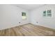 This bedroom offers natural light and beautiful flooring at 2120 Shadyview Dr, Charlotte, NC 28210