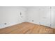 This bedroom offers hardwood flooring, base molding and a light and bright space at 2120 Shadyview Dr, Charlotte, NC 28210