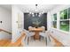 Cozy dining area featuring a round wooden table and modern light fixture at 2120 Shadyview Dr, Charlotte, NC 28210