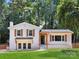 Charming white brick home with a well-manicured lawn and inviting wood shutters at 2120 Shadyview Dr, Charlotte, NC 28210