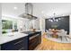 Open concept kitchen showcasing modern appliances and seamless flow to the dining area at 2120 Shadyview Dr, Charlotte, NC 28210