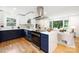 Modern kitchen with stainless steel appliances, and stylish blue lower cabinets at 2120 Shadyview Dr, Charlotte, NC 28210