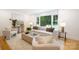 Bright living room featuring large windows, comfortable seating, and neutral decor at 2120 Shadyview Dr, Charlotte, NC 28210