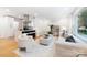 Bright, open-concept living space with hardwood floors and stylish modern furnishings at 2120 Shadyview Dr, Charlotte, NC 28210