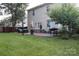 Spacious backyard featuring a brick patio with comfortable seating and lush green grass at 3092 S Legacy Park Blvd, Fort Mill, SC 29707