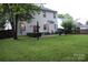 Expansive backyard featuring a brick patio with modern seating and a well-maintained lawn at 3092 S Legacy Park Blvd, Fort Mill, SC 29707
