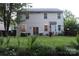 Large backyard with a patio, string lights, and ample lawn space at 3092 S Legacy Park Blvd, Fort Mill, SC 29707
